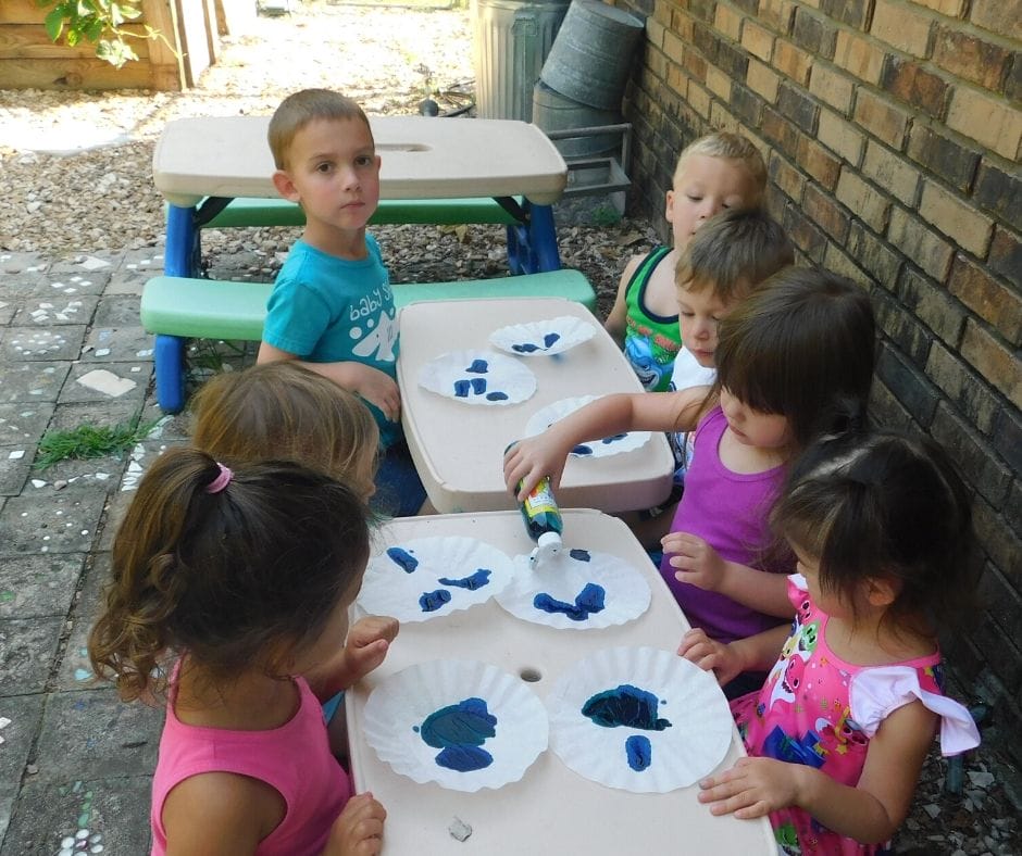 kids painting coffee filters