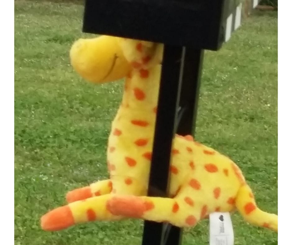 Stuffed garaffe hanging on mailbox for scavenger hunt