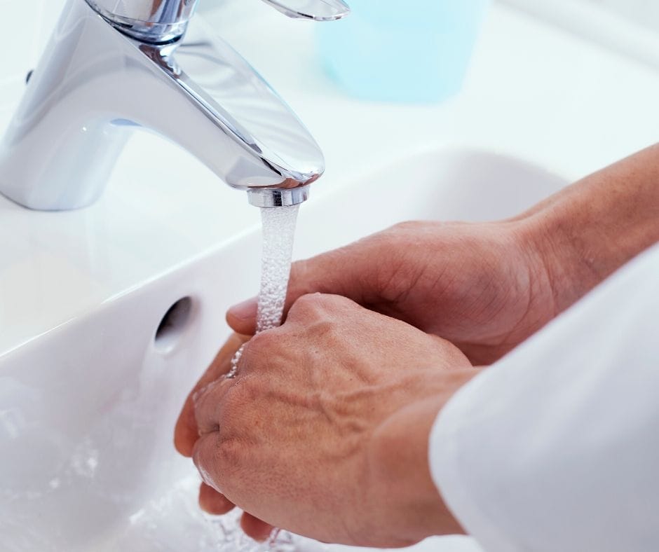 washing hands in the sink