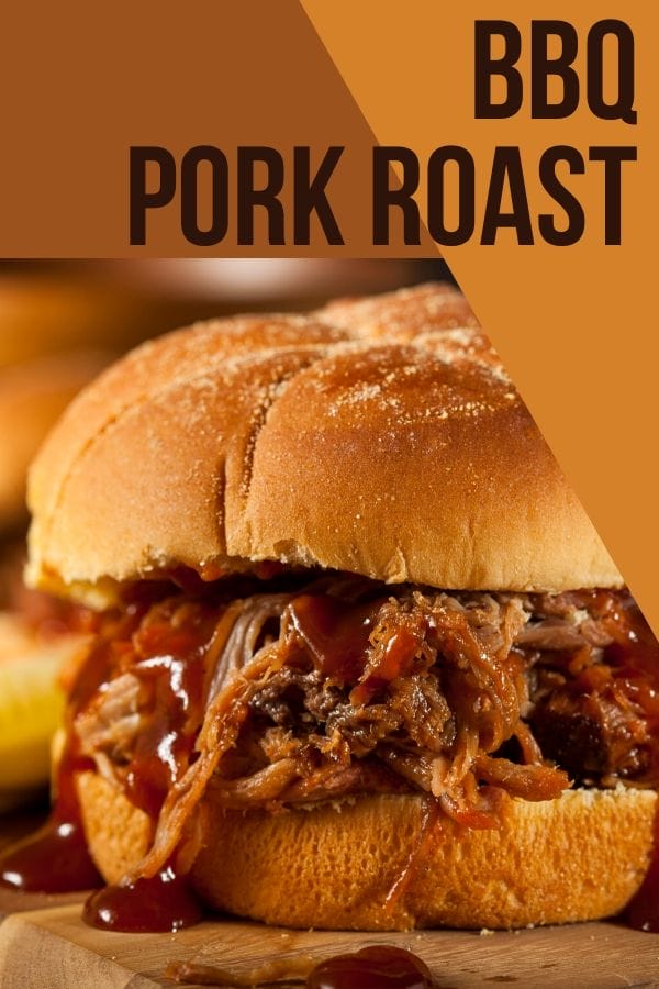 BBQ pork roast sandwich dripping with barbecue sauce on a board