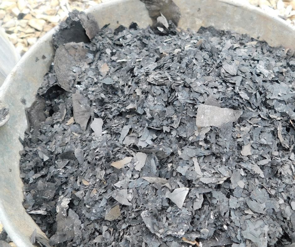 metal bucket full of ashes
