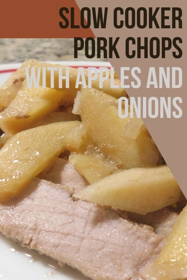 slow cooker pork chops with apples and onions fresh out of the crock pot and sliced up on a plate