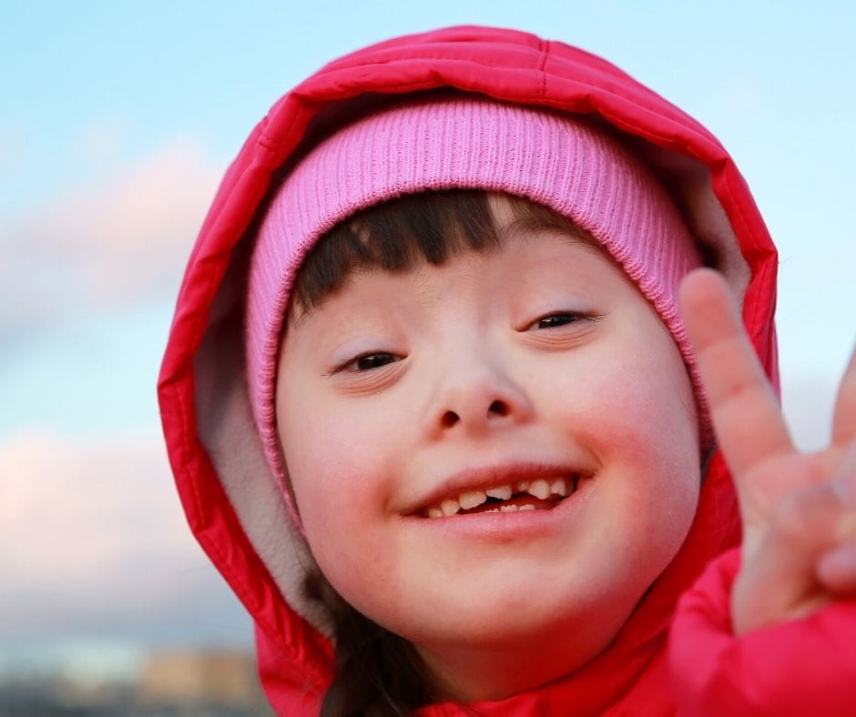 child giving the peace sign