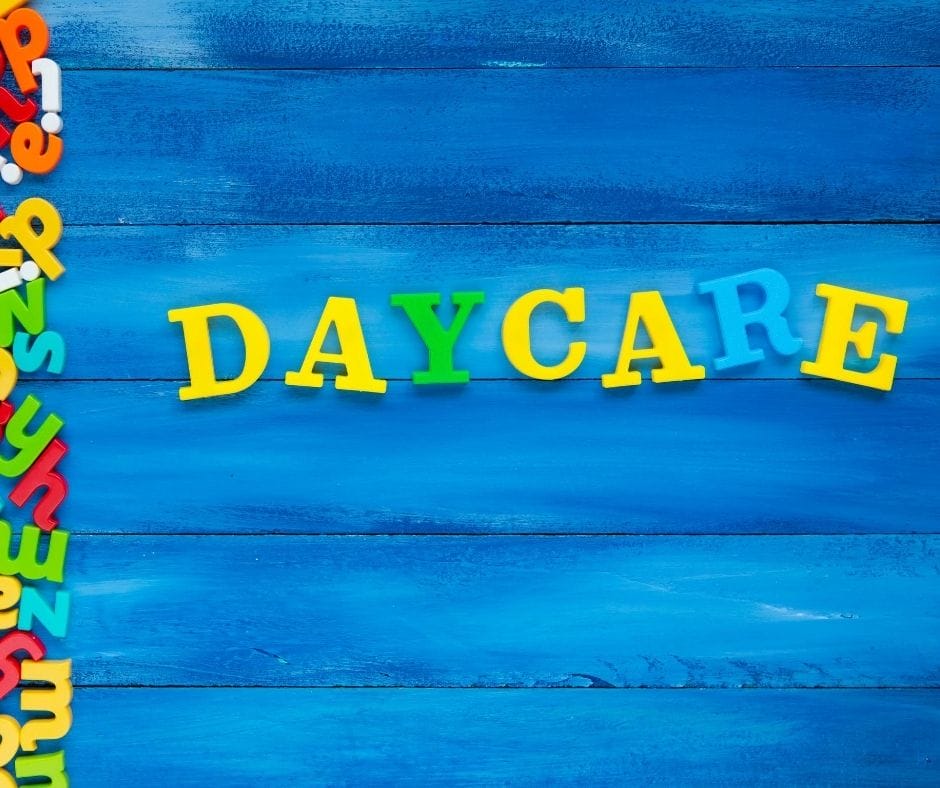 daycare sign, blue wood with plastic magnetic letters