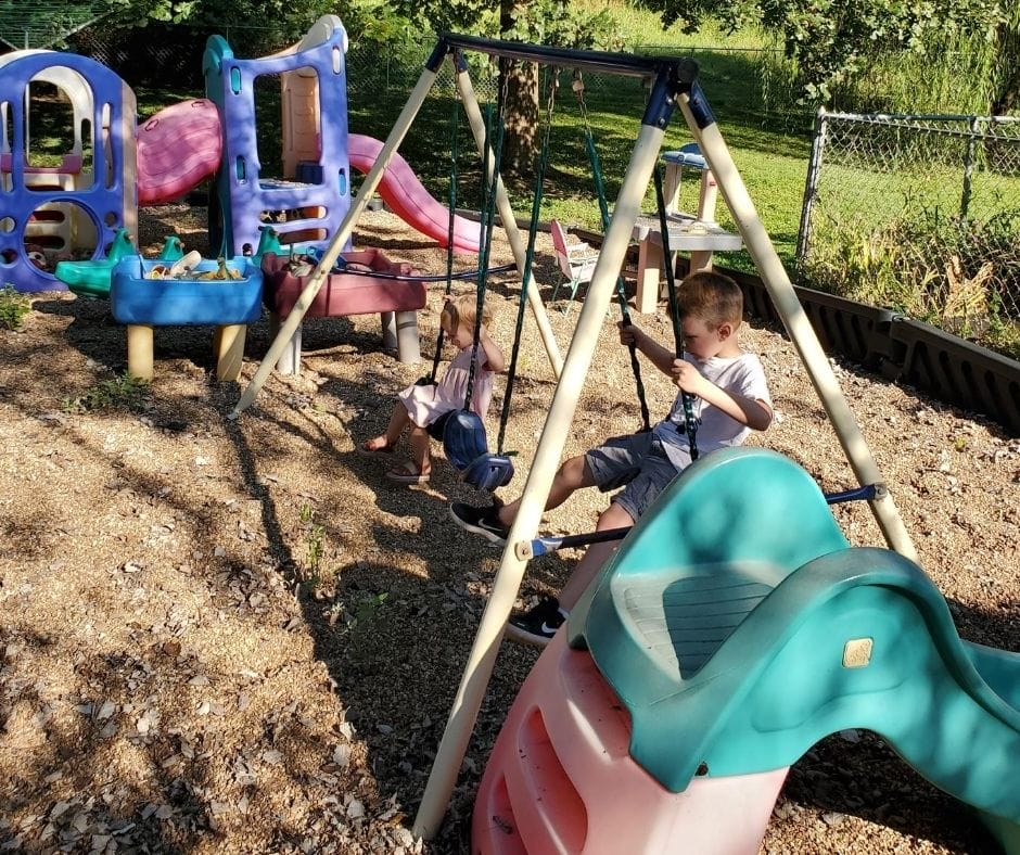 metal swing set on home daycare playground