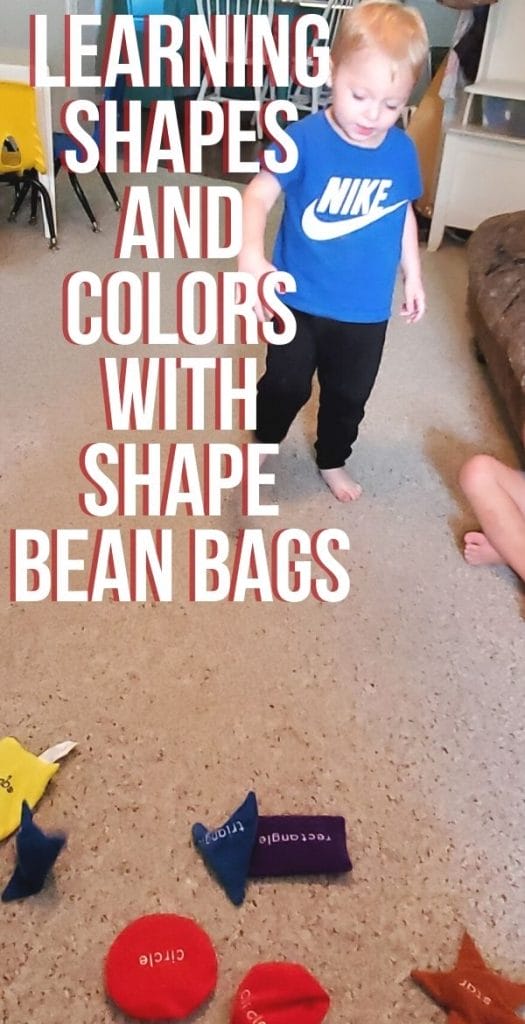 Kids playing with shape bean bags on the carpet