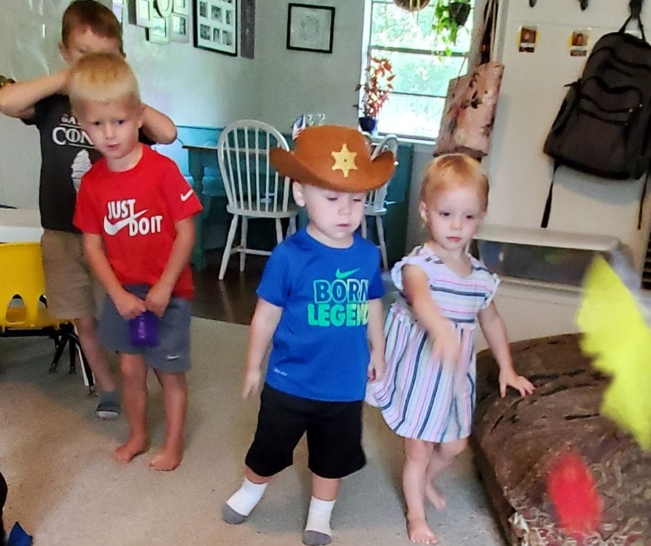 kids throwing shape bean bags and identifying shapes and colors