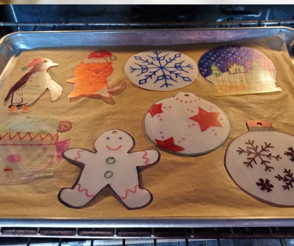 baking sheet in oven with shrinky dinks on it.