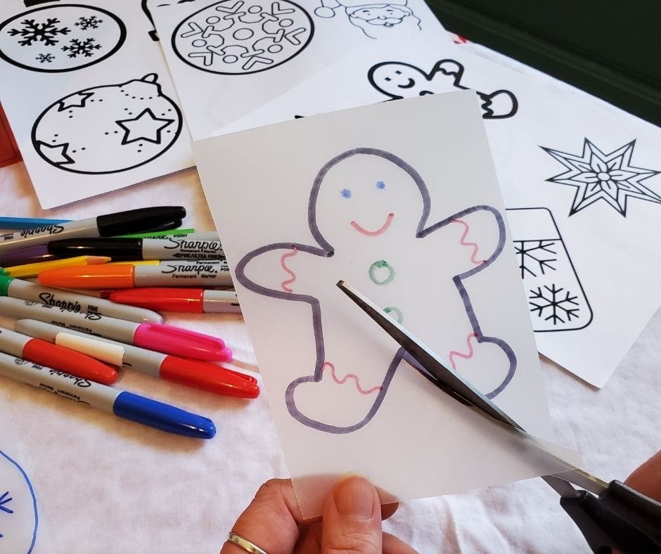 cutting shrinky dinks out with scissors