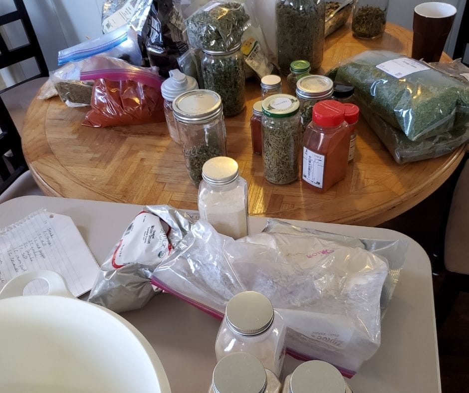 tables full of spices and herbs for garlic bread sprinkle and spice mix blends