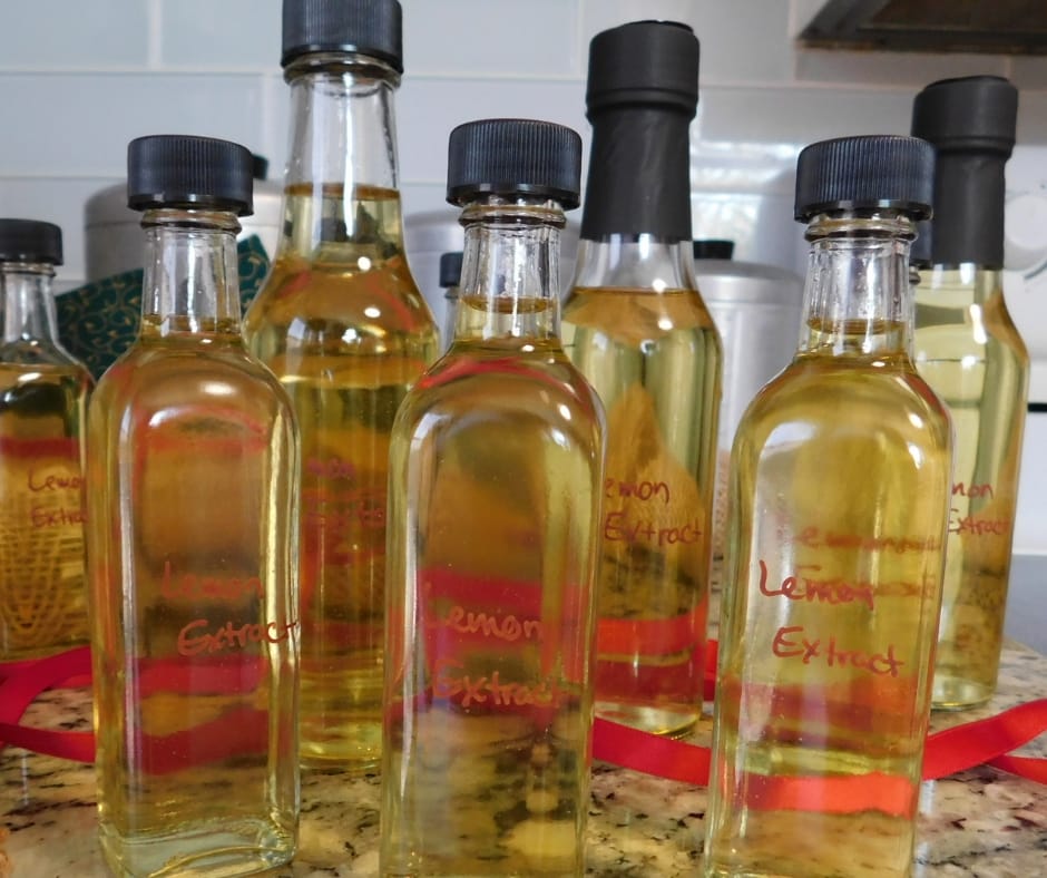 bottles of homemade lemon extract on the counter