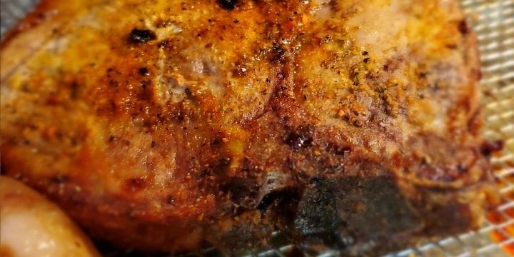 Pork chops on a tray, nicely browned in air fryer