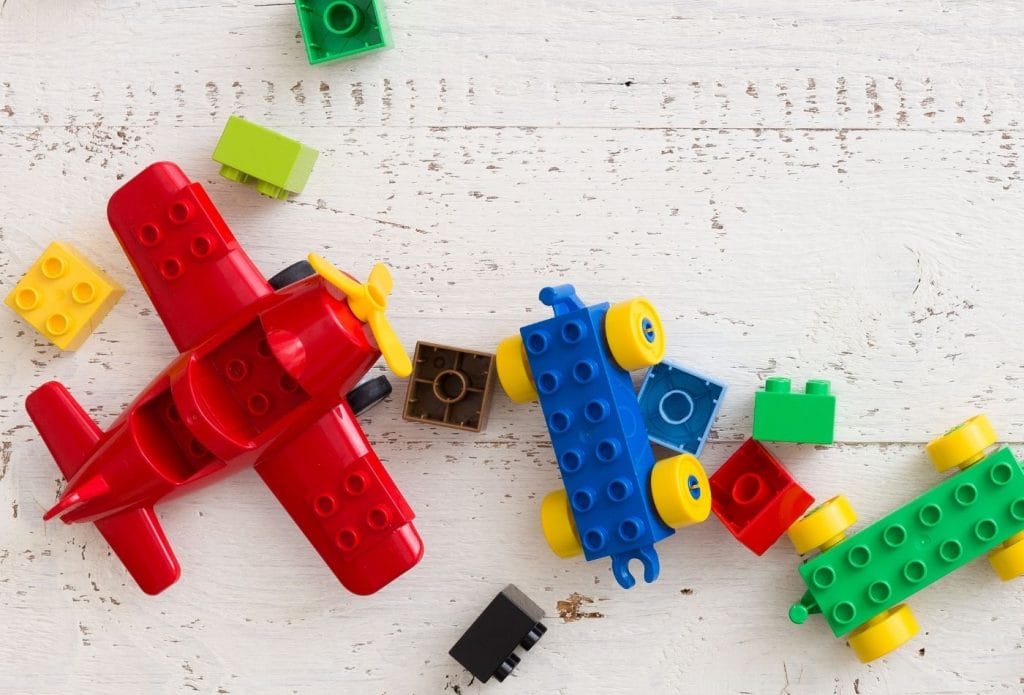 a toy airplane and some blocks for indoor scavenger hunt