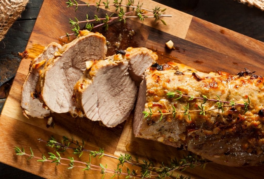 pork tenderloin sliced on a board