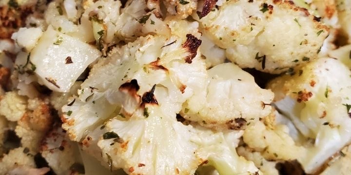 air fryer cauliflower piled up in a container