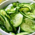 Sliced cucumbers in a bowl with onions
