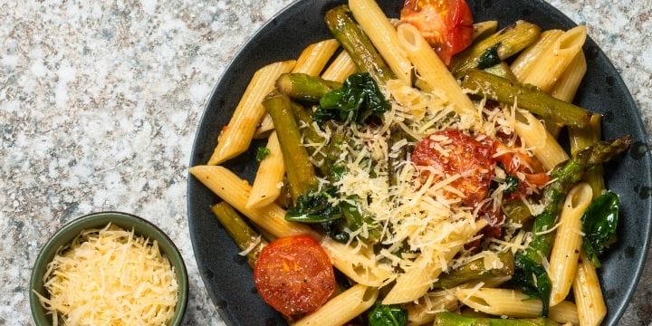 Healthy meatless meal of pasta with veggies and cheese on top