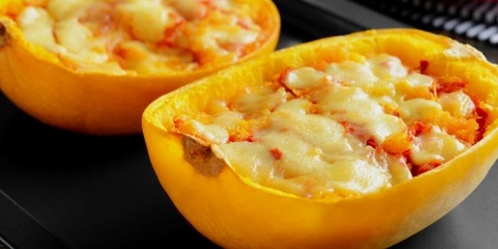 stuffed spaghetti squash lasagnas on a board