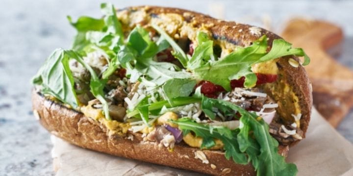 Big gorgeous meatless sandwich on a long bun and covered in veggies