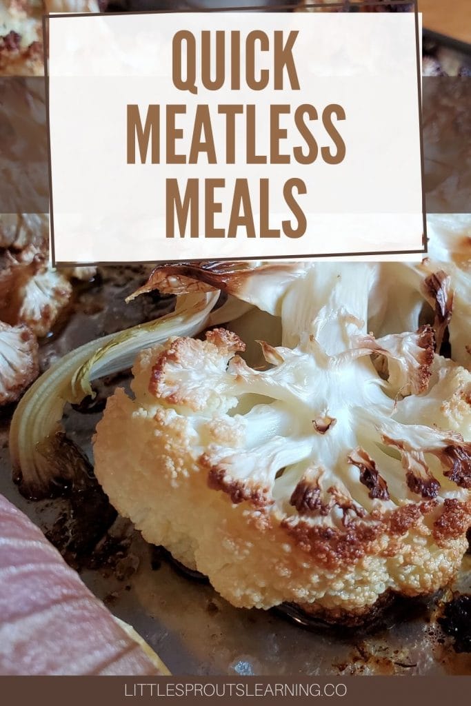 cauliflower steaks and onions on a roasting pan