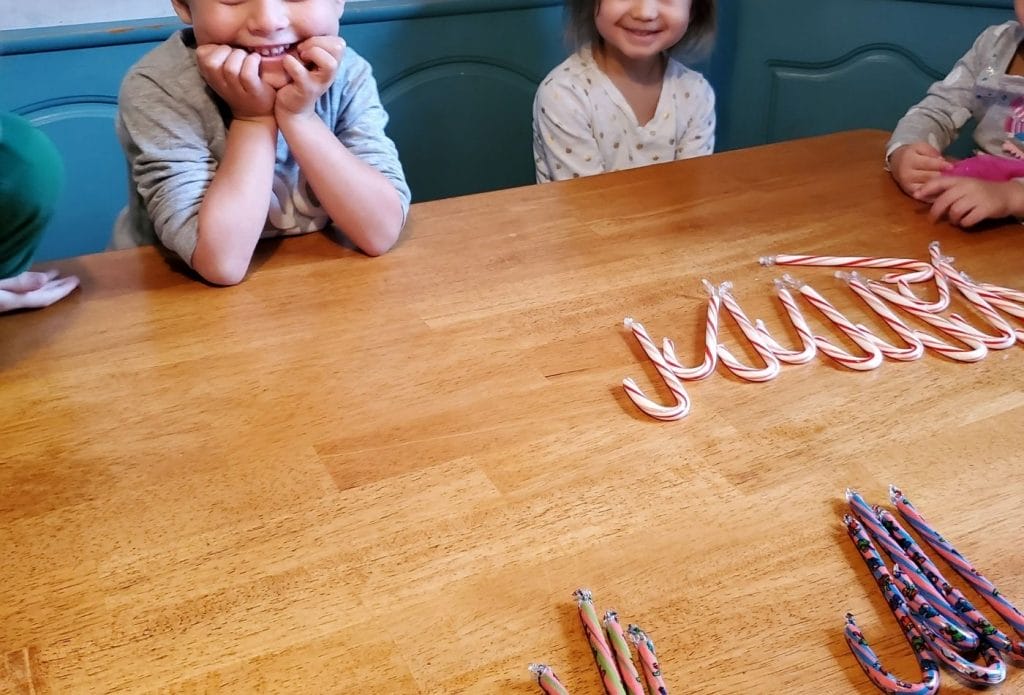 candy canes sorted on the table by color