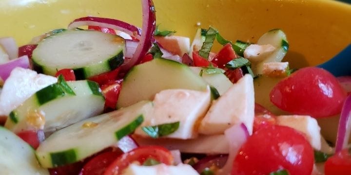 Cucumber and tomato salad is a healthy side dish that is light and refreshing. Made with garden tomatoes, cucumbers, red onion, it's the easiest salad you’ll make! And so good you'll want to make it every week! Click here for even more cucumber recipes.