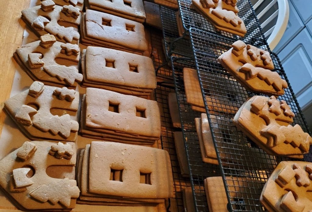 gingerbread house pieces baked and cooling for assembly