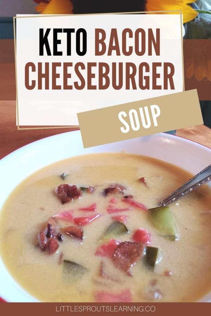 Keto Bacon Cheeseburger soup in a bowl with a spoon on the table