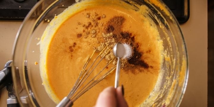 bowl of pumpkin puree and ingredients in a mixing bowl