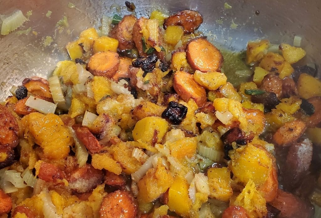 roasted vegetables mixed together in a pan