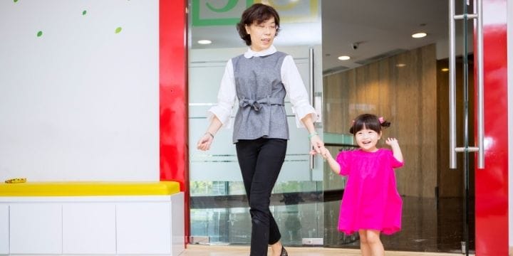 child being picked up from daycare