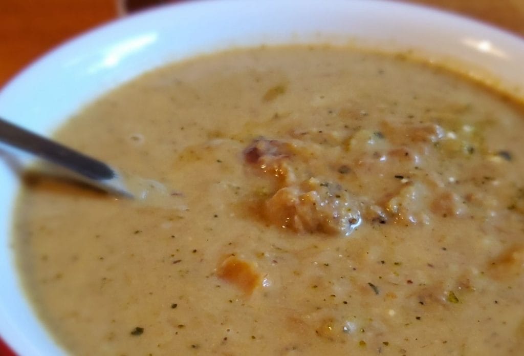 bowl of broccoli sweet potato pork soup