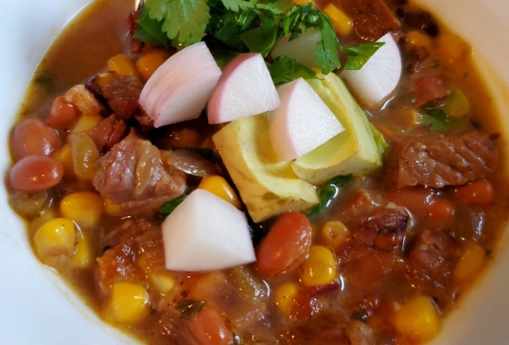 soup makes a great make-ahead freezer meal, especially this delicious mexican inspired leftover brisket soup that has corn, beans, onions, and the flavors of posole. It's topped with radishes, avocados and cilantro too. 
