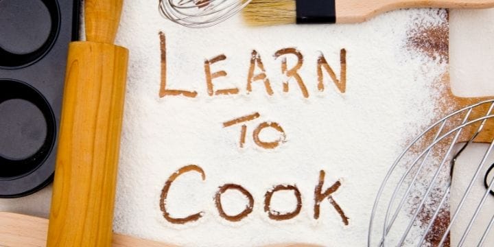 flower on a board with learn to cook written in it