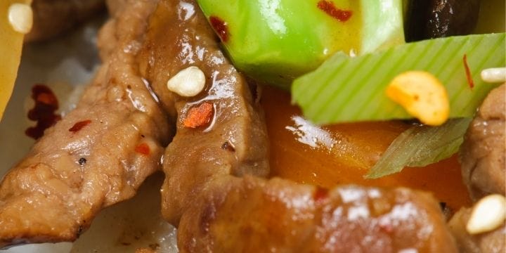 make ahead freezer stir fry on a plate, showing beef, broccoli, and green onions