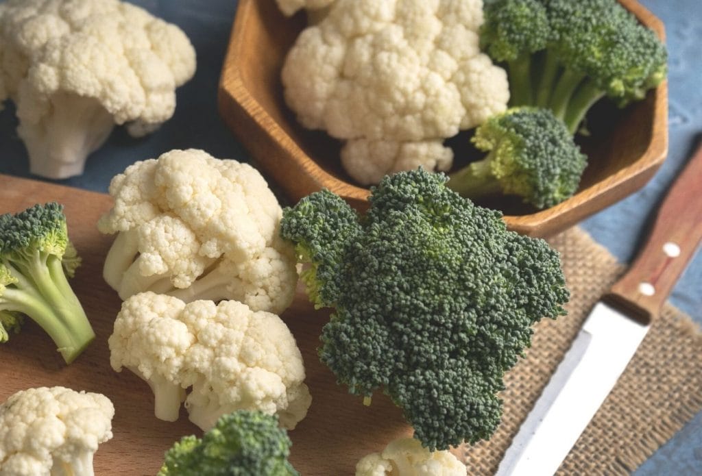 Broccoli and cauliflower on a cutting board