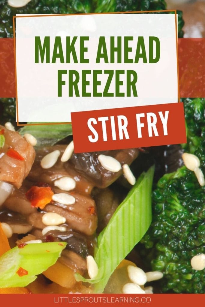 make ahead freezer stir fry with broccoli, onions, cauliflower, carrots, and beef on a plate sprinkled with red pepper flakes and sesame seeds