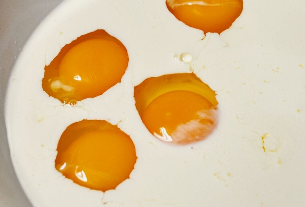 eggs and milk in a bowl for quiche filling