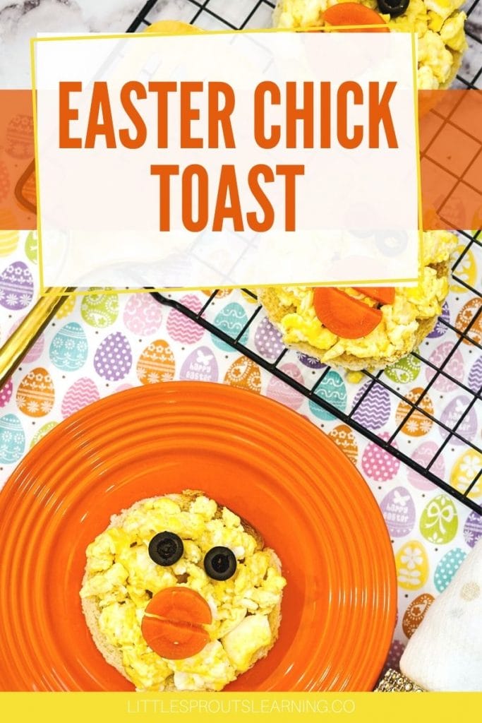 Toast, cut into a round and topped with scrambled eggs with a veggie face on an orange plate next to a tray full of easter chick toasts