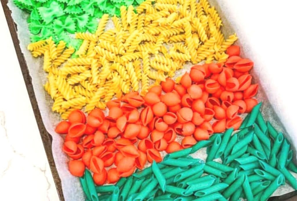 homemade bright, colorful pasta in a tray dyed for art projects for kids
