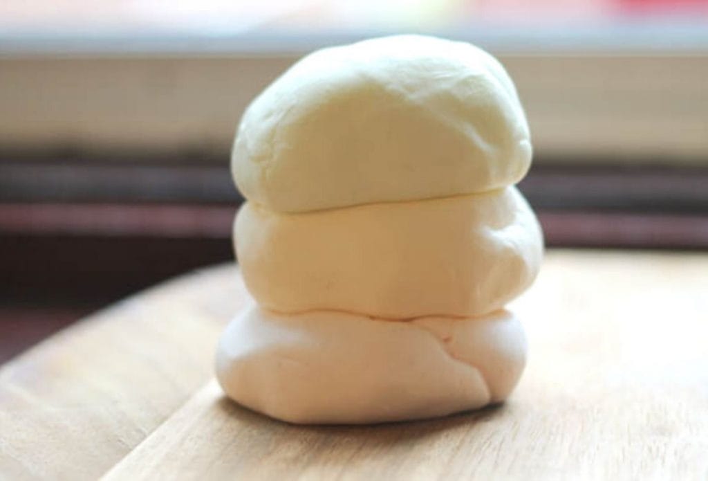 piles of homemade scented playdough stacked up on a board
