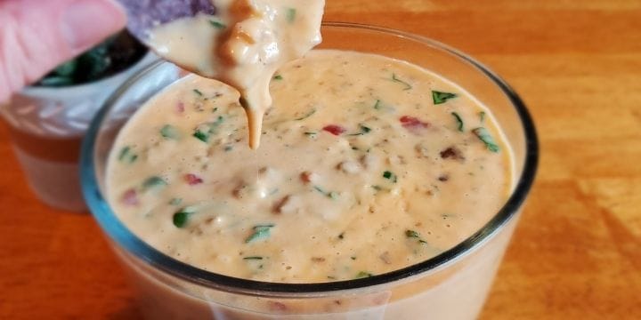 rotel dip with real cheese on a chip dripping off