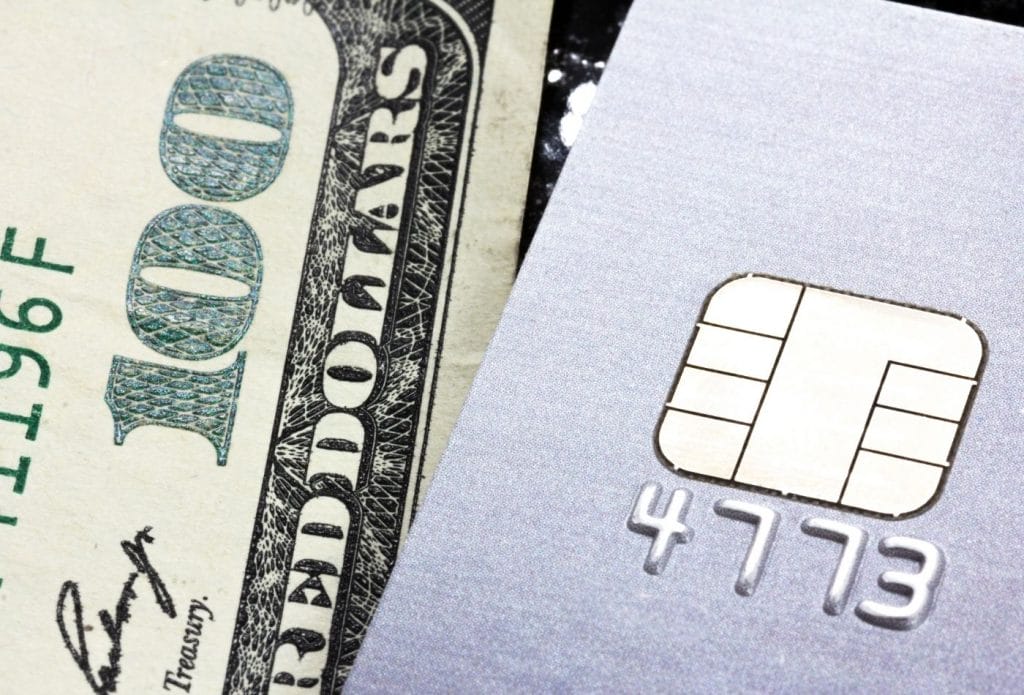 cash and credit card close up of the corner