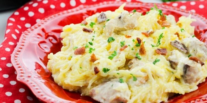 crack chicken spaghetti squash on a red plate with a red napkin