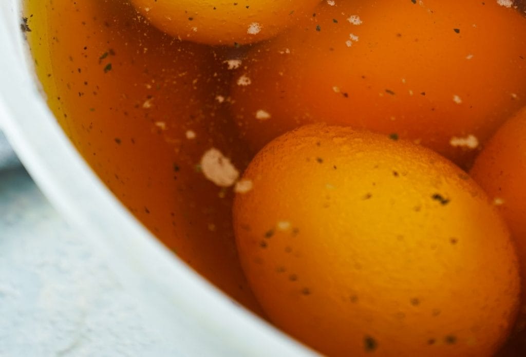 boiled eggs in brown liquid
