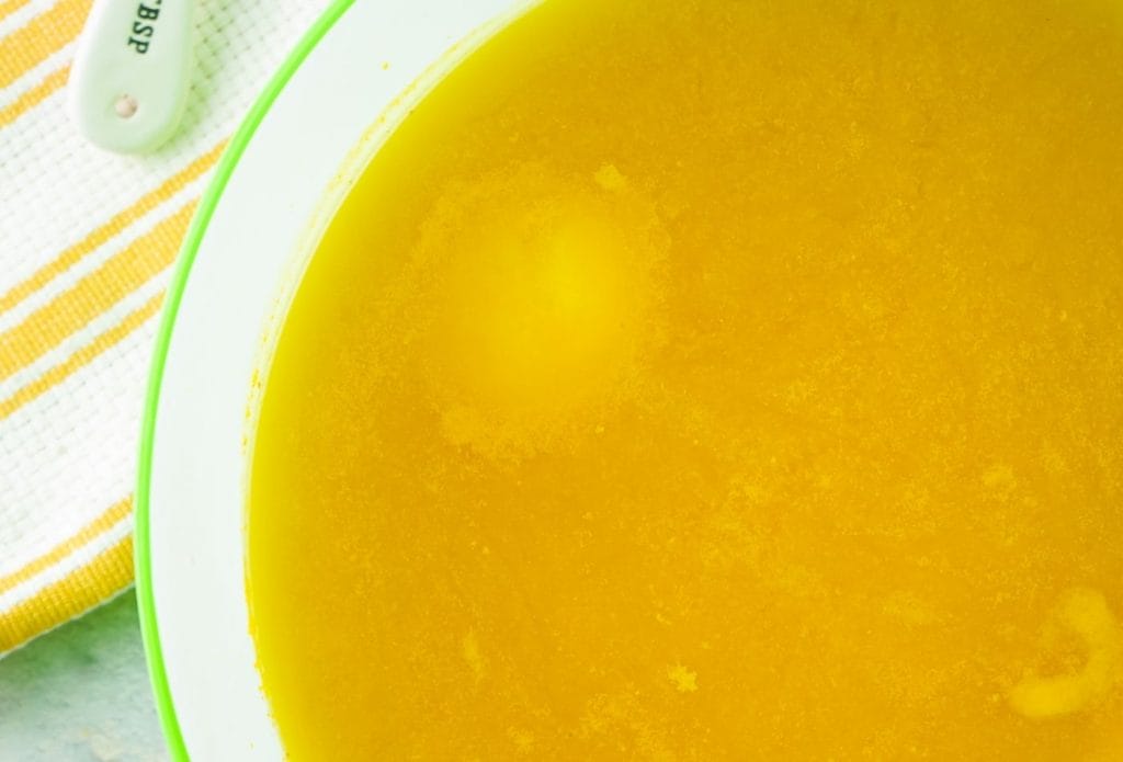 boiled eggs soaking in a yellow liquid