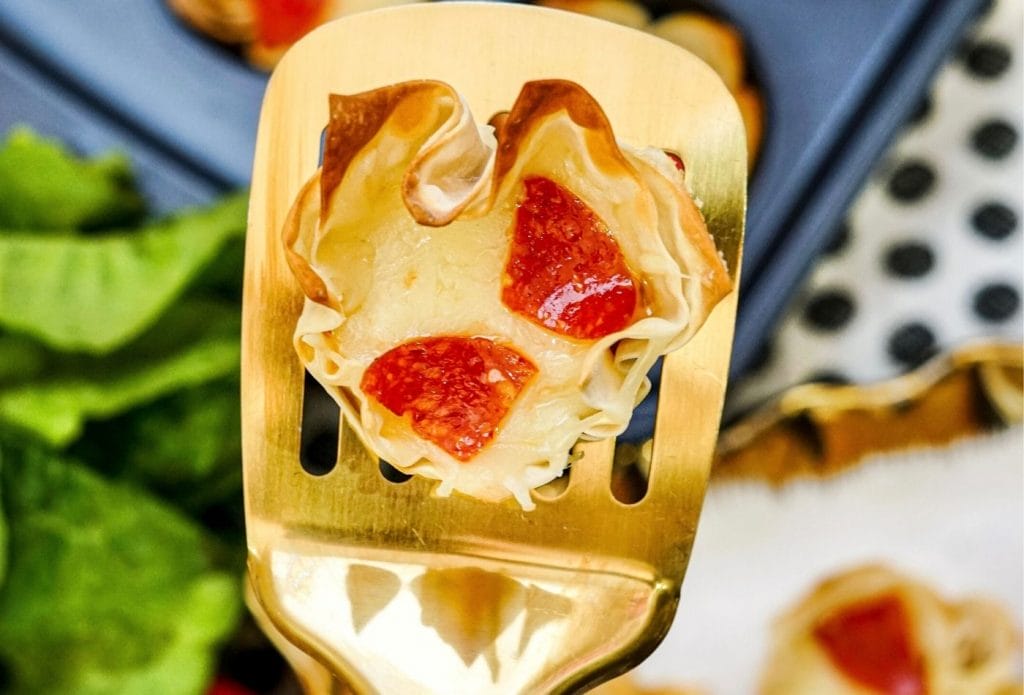 close up of pizza cup on a spatula