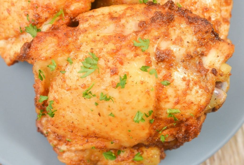 close up of air fryer chicken thighs on a plate