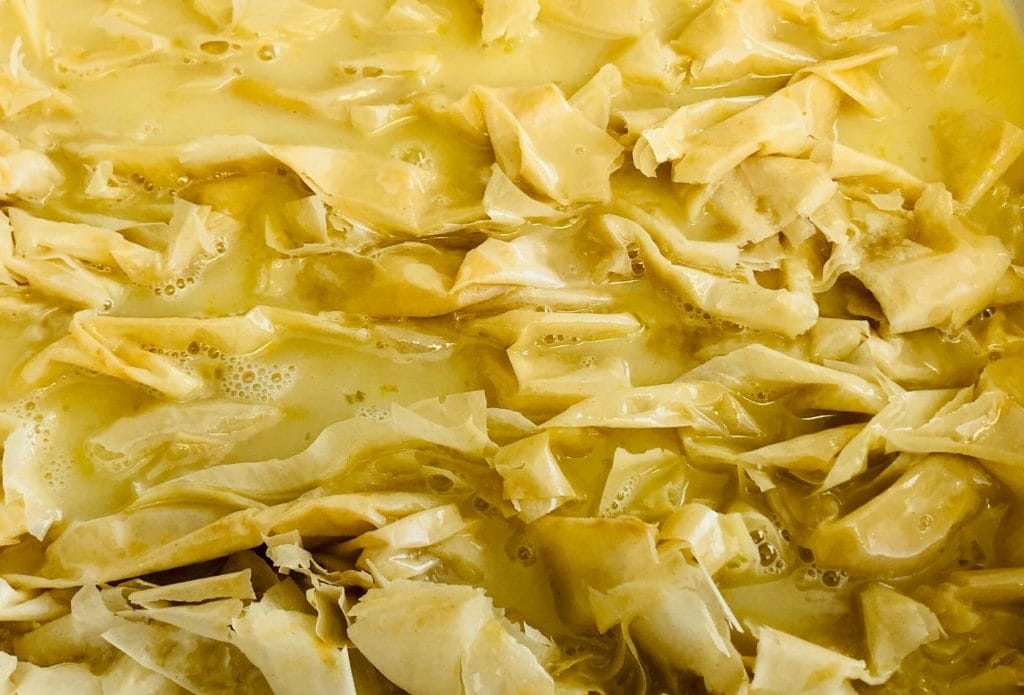 crinkled phyllo dough with custard filling poured on