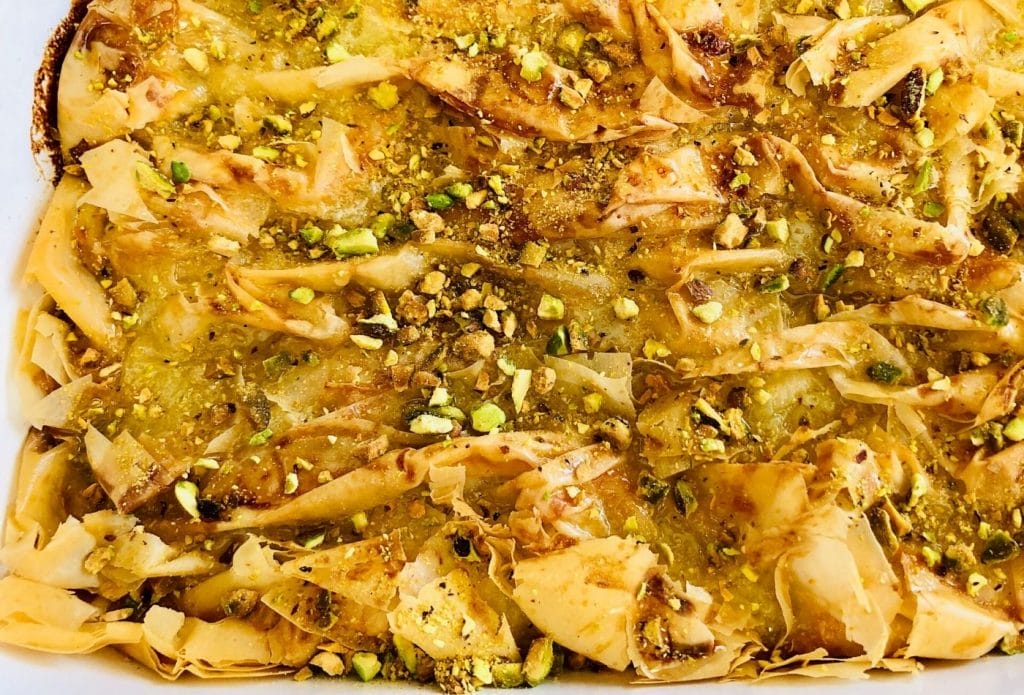 casserole dish full of lemon pistachio custard crinkle